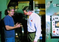 Part-off operations at Multax Corp. routinely cut tube-shaped forgings into shorter lengths for subsequent machining. Multax machining supervisor, Don Woerner, and Sandvik Coromant representative, Rob Page, examine a heat resistant super-alloy ring parted with Sandvik CoroCut tools and GC1005 inserts. 