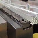 Image - Long Serrated Grips Maintain Contact on Full-Length of Workpiece